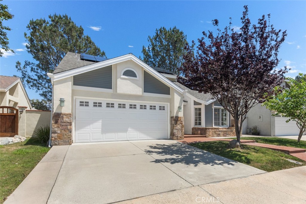Two Car Garage with wide driveway. Attic Stairs access the additional storage in garage. - 10 Windflower, Aliso Viejo CA 92656 - photo 2