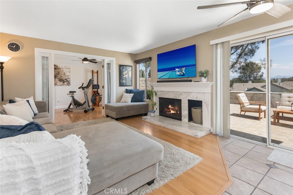 Family room is adjacent to Kitchen and features a fireplace - 10 Windflower, Aliso Viejo CA 92656 - photo 9