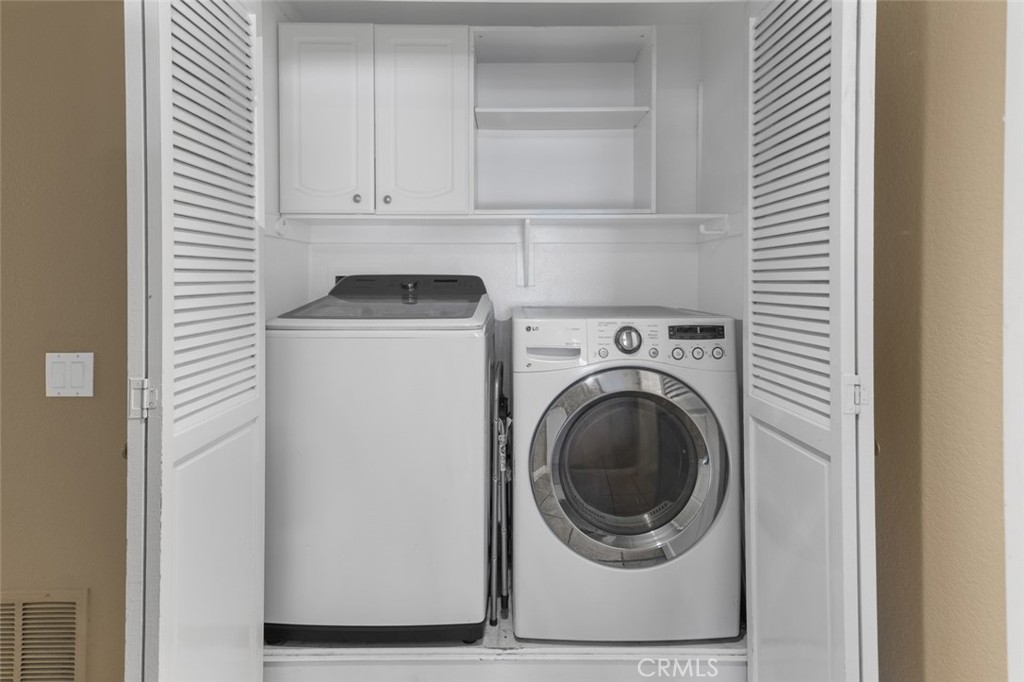 Downstairs Laundry Closet with overhead storage built-in - 10 Windflower, Aliso Viejo CA 92656 - photo 26