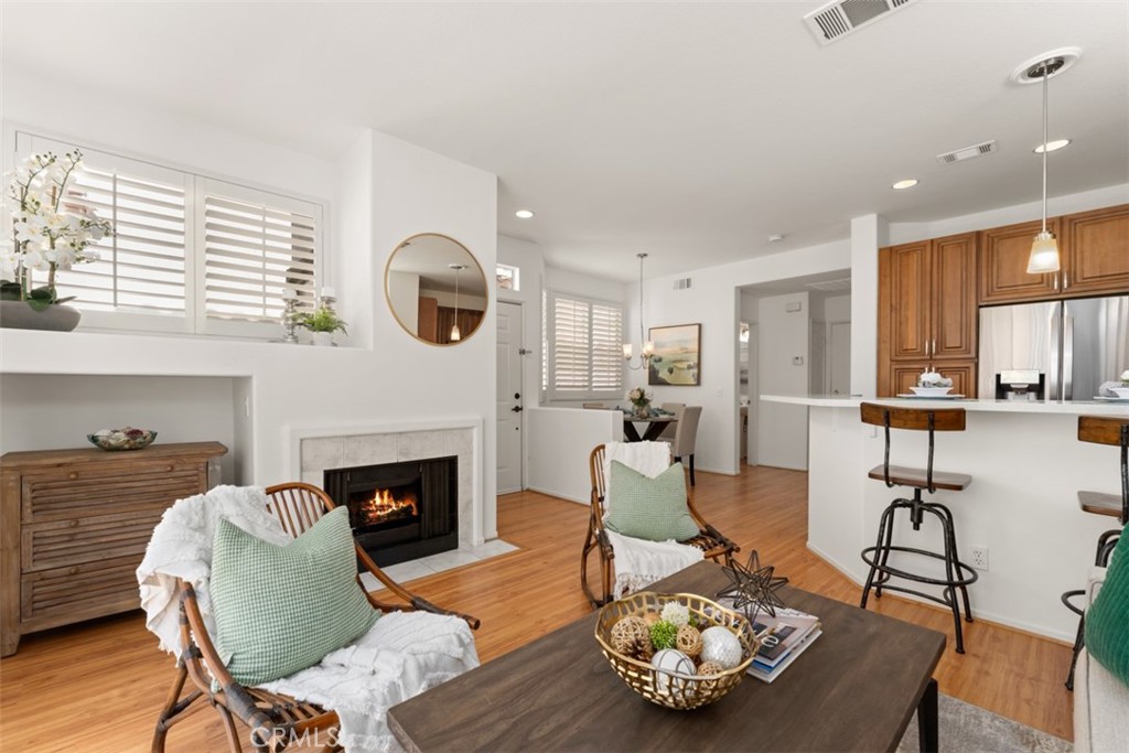 Welcome home! High ceilings, solid surface flooring throughout, remodeled kitchen, and more. - 148 Las Flores, Aliso Viejo CA 92656 - photo 1
