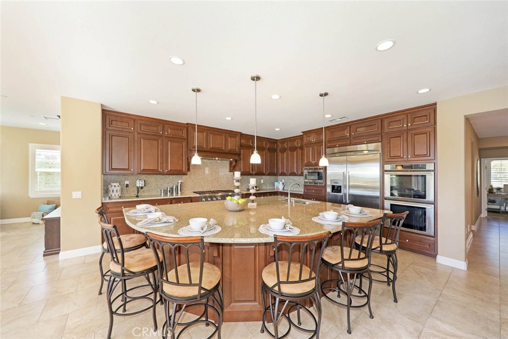 Stunning chef's kitchen with extra large center island w/bar seating. - 16 Emerald Terrace, Aliso Viejo CA 92656 - photo 1