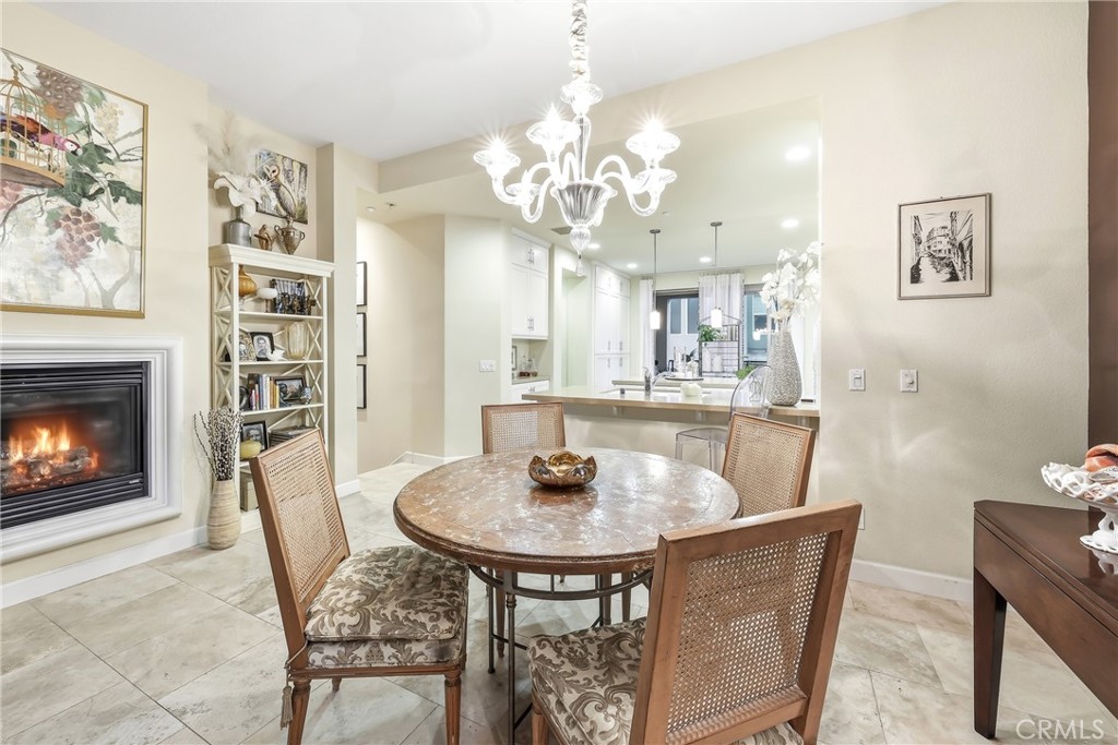 High ceilings, elegant stone floors and natural light on main level - 23 Vantis, Aliso Viejo CA 92656 - photo 6
