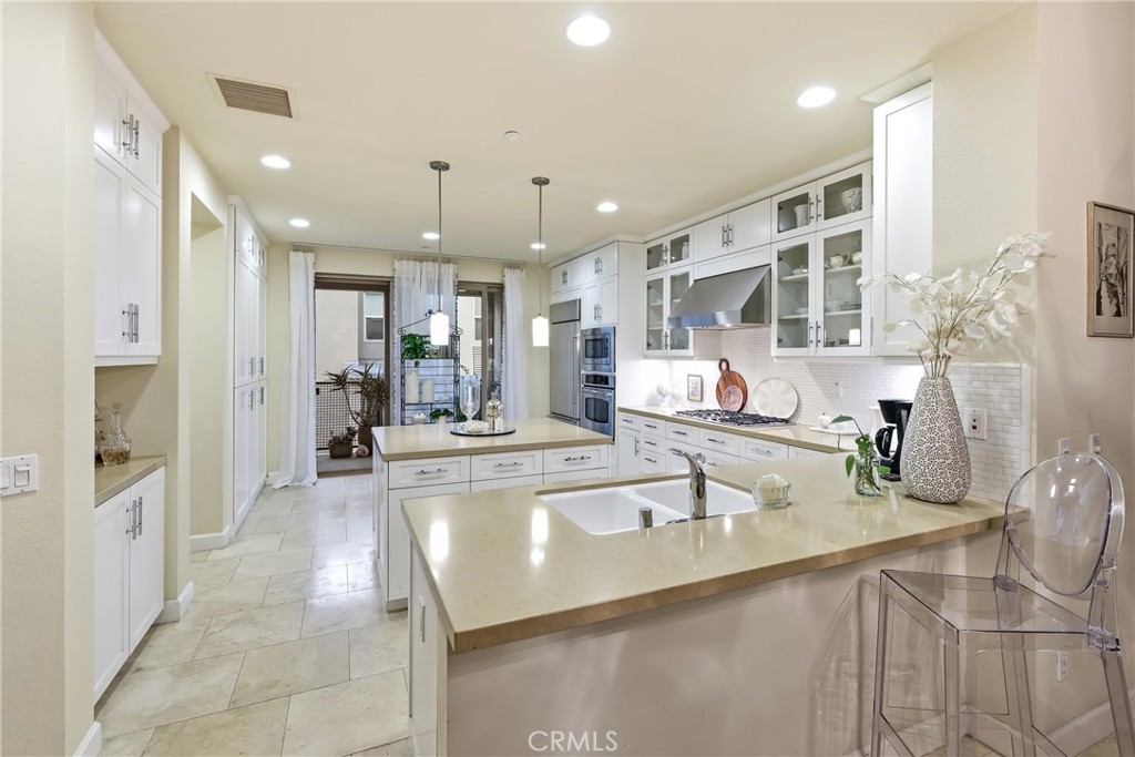 Grand open-concept kitchen with luxury appointments - 23 Vantis, Aliso Viejo CA 92656 - photo 7