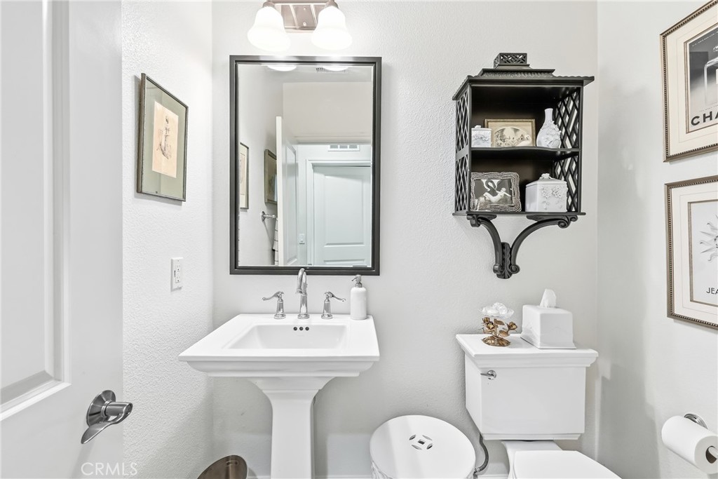 Main level powder room with elegant fixtures - 23 Vantis, Aliso Viejo CA 92656 - photo 15