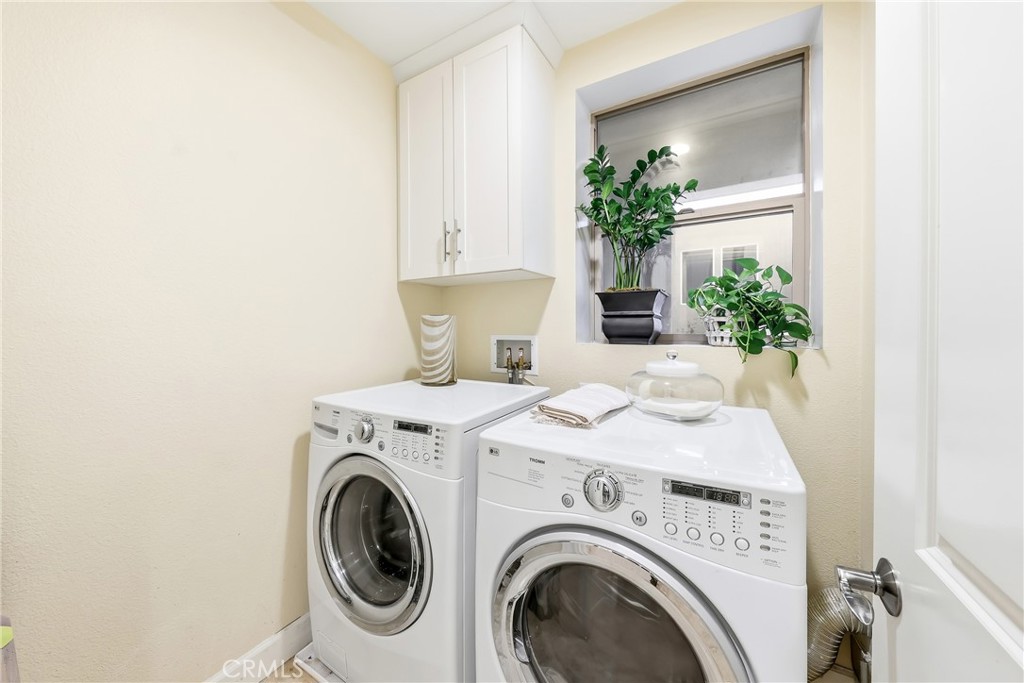 Main level laundry room, with full size equipment, east facing window and ample storage - 23 Vantis, Aliso Viejo CA 92656 - photo 16