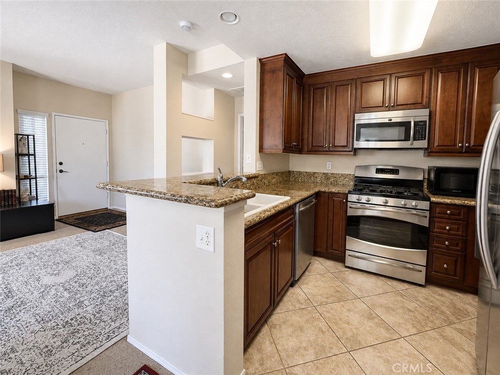 Kitchen/Living room - 23412 Pacific Park 39J, Aliso Viejo CA 92656 - photo 3
