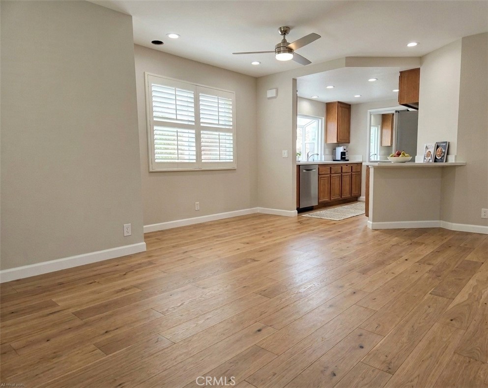 AI STAGED: Reimagined with stunning wood-look flooring that combines timeless warmth with modern durability. - 40 Hollyhock, Aliso Viejo CA 92656 - photo 7