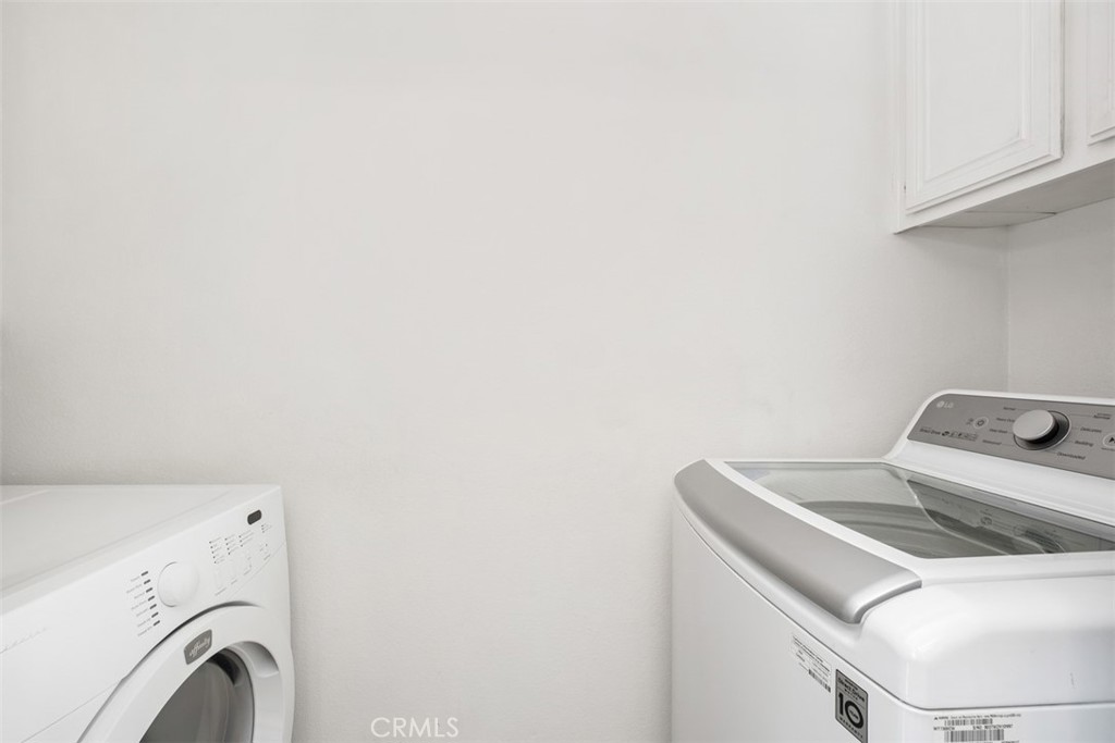 Laundry room featuring mirrored folding doors. - 40 Hollyhock, Aliso Viejo CA 92656 - photo 13