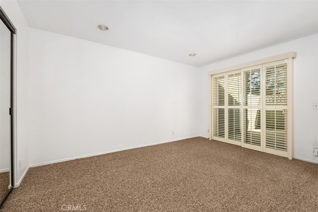 Primary Bedroom with Newer Dual-Pane Sliding Glass Door & Private Deck Access. - 40 Hollyhock, Aliso Viejo CA 92656 - photo 16