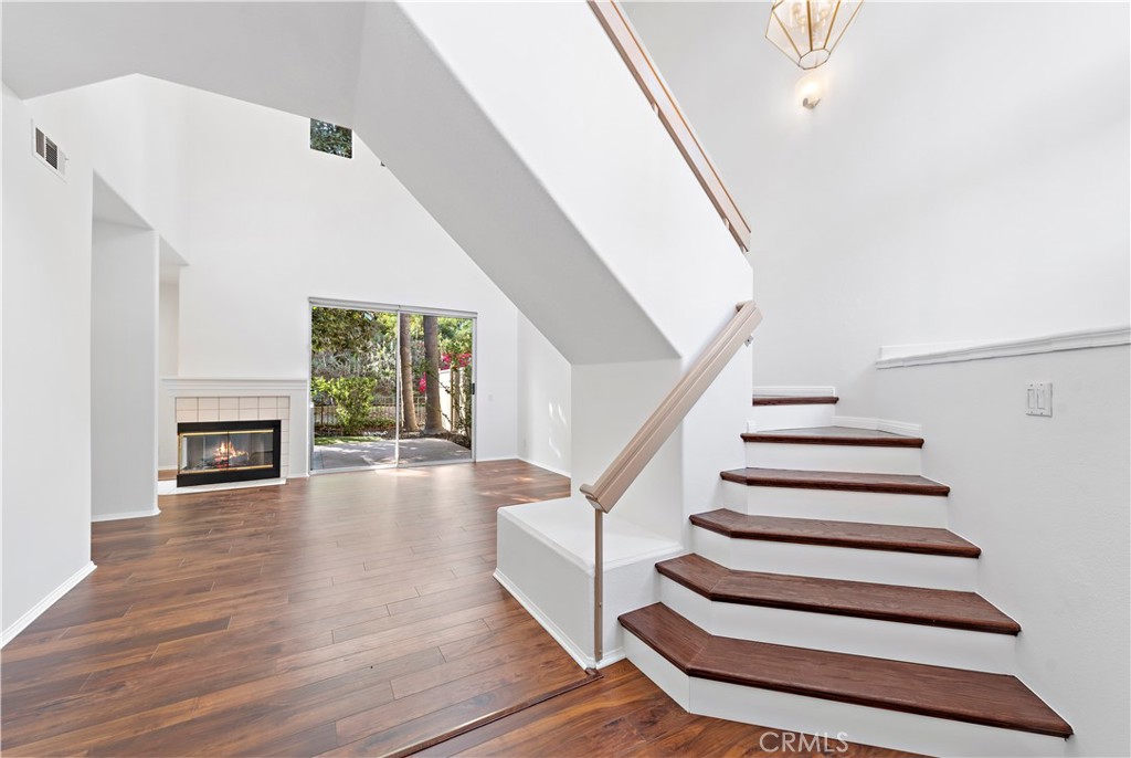 Dramatic foyer welcomes you into this bright and light home. Upgraded waterproof flooring and designer stair risers. Ple - 47 Donatello, Aliso Viejo CA 92656 - photo 2