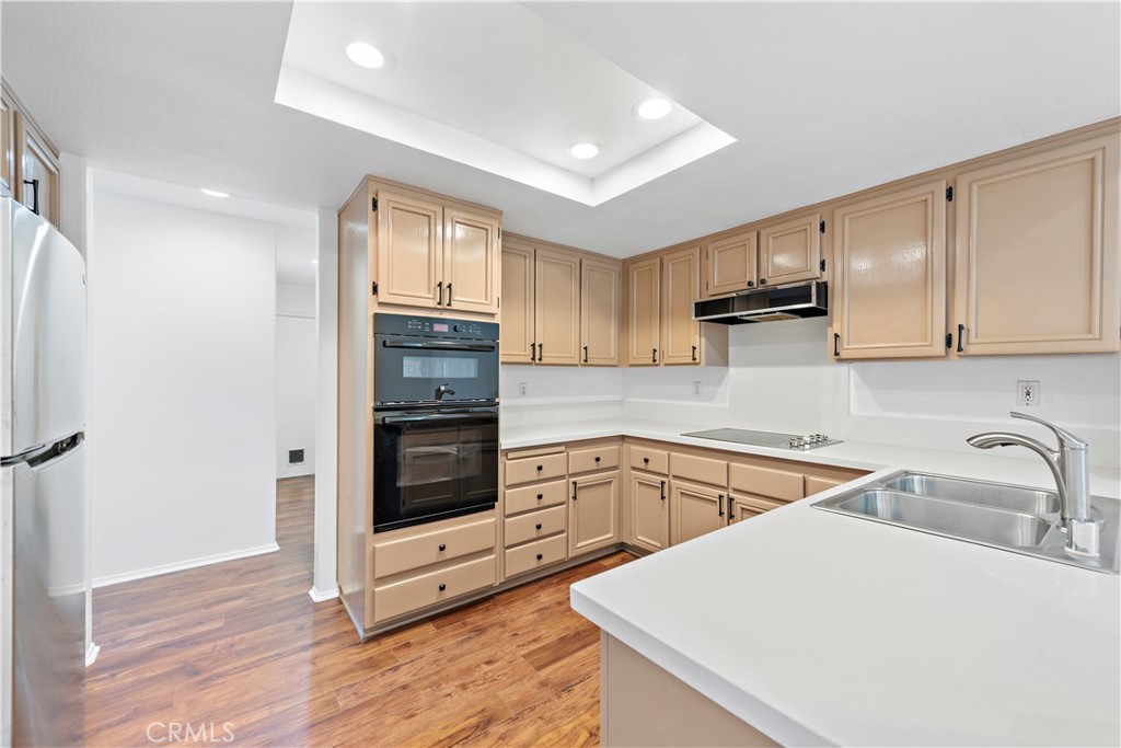 Upgraded chef kitchen boasts upgraded appliances including fridge/oven/microwave and induction stove. Clean new Quartz c - 47 Donatello, Aliso Viejo CA 92656 - photo 8