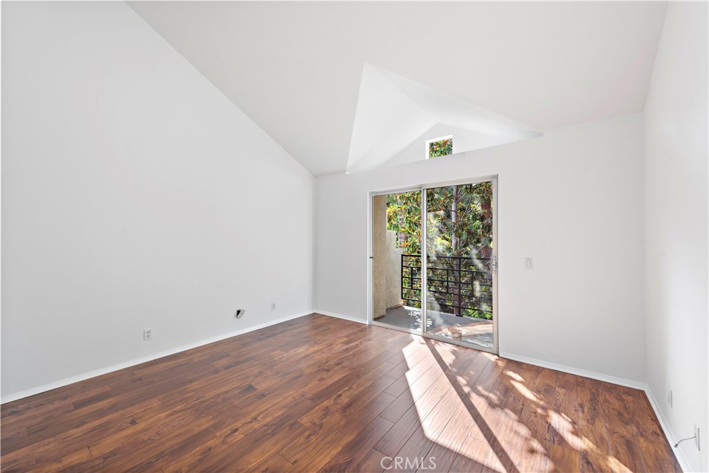Vaulted ceilings and private balcony off primary suite. - 47 Donatello, Aliso Viejo CA 92656 - photo 14