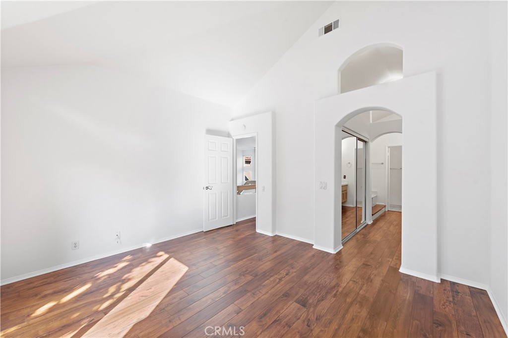 Dual closets lead to an upgraded primary bathroom suite with jacuzzi tub and tiled shower. - 47 Donatello, Aliso Viejo CA 92656 - photo 15