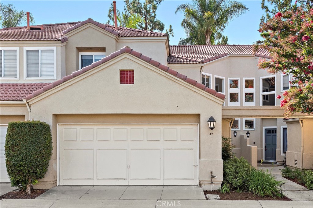 Townhome inspired living with private attached two car garage. Garage door has been updated since photo. - 47 Donatello, Aliso Viejo CA 92656 - photo 24