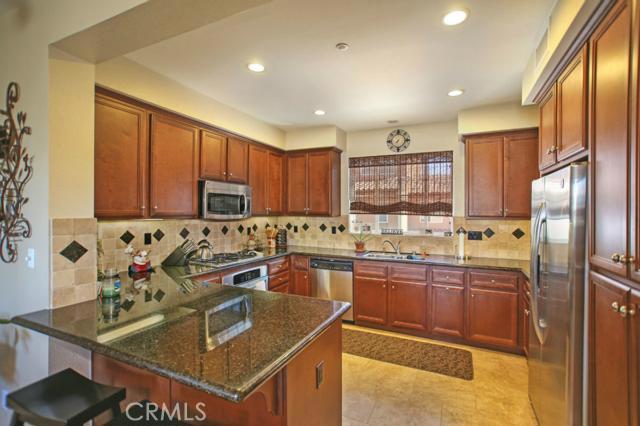 Upgraded Kitchen Features Ample Maple Cabinetry, Stainless Steel Appliances, Stainless Steel Sink, Granite Countertops, - 5 Playa Circle A, Aliso Viejo CA 92656 - photo 1