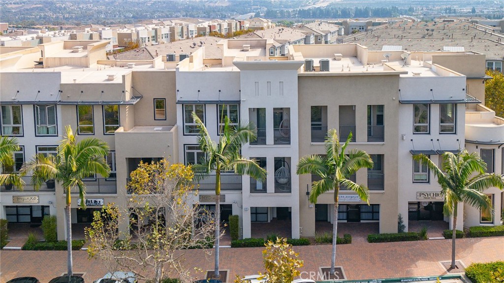 Façade of the building. Our unit is the big white building right in the middle between the 2 beige units. It has 3 level - 57 Vantis Drive, Aliso Viejo CA 92656 - photo 1