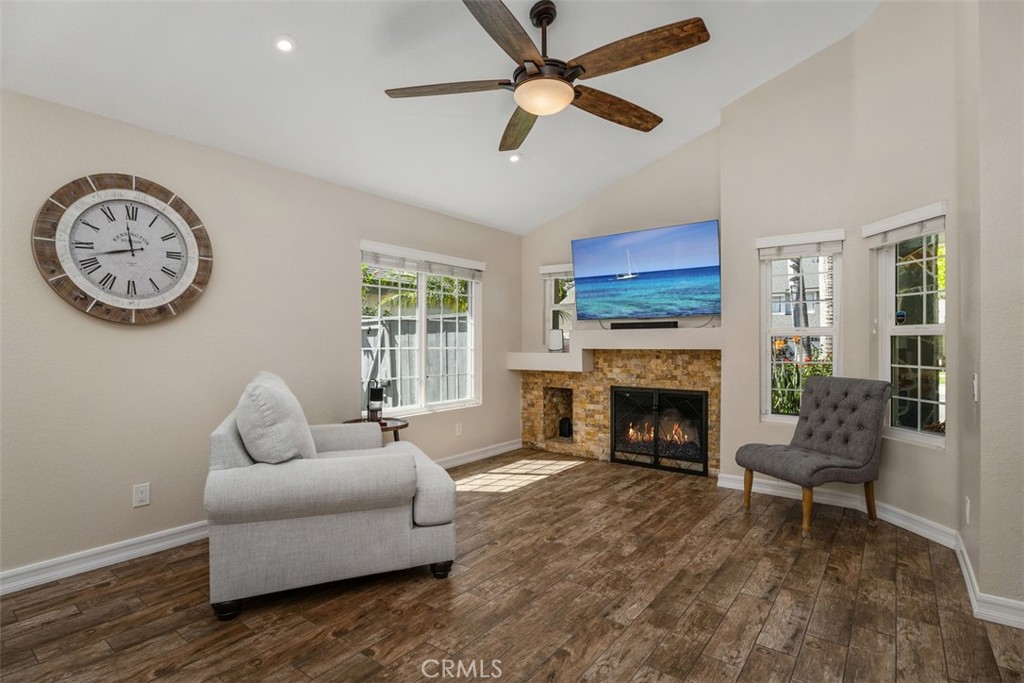 Living Room (w/ virtual digital image on the TV and fire in fireplace).Original unaltered photo shown adjacent. Buyer to - 6 Briarglenn, Aliso Viejo CA 92656 - photo 4