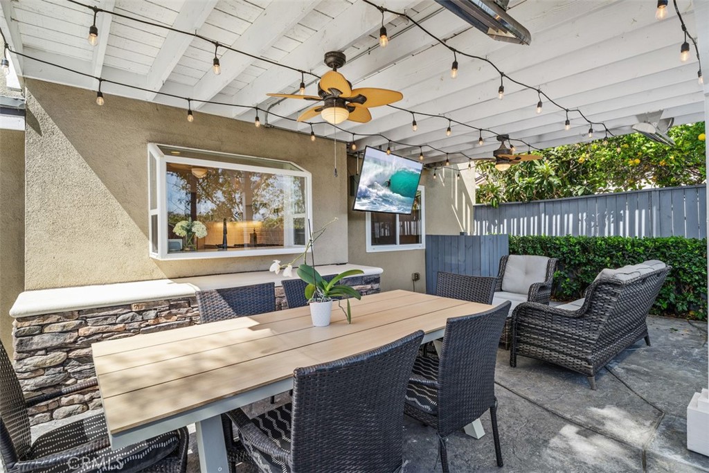 Backyard Patio (w/ virtual digital image on the TV). Original unaltered photo shown adjacent. Buyer to verify operation. - 6 Briarglenn, Aliso Viejo CA 92656 - photo 21