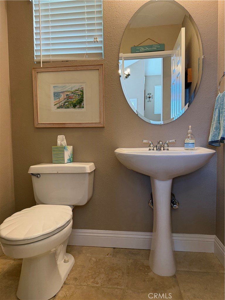 Convenient half bath just off the entry for guests - 6 Mallorn, Aliso Viejo CA 92656 - photo 26