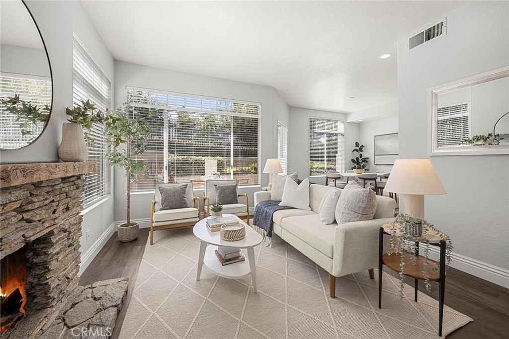 One of the best features of this home is how connected everything feels. The living room flows seamlessly into the dinin - 66 Cinnamon Teal, Aliso Viejo CA 92656 - photo 7