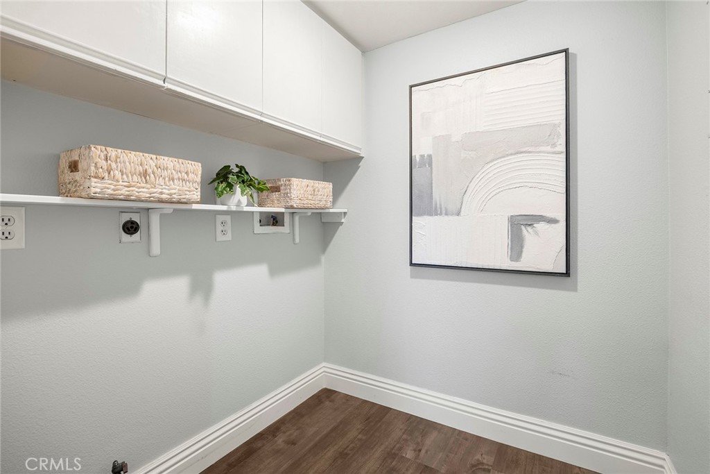 A dedicated inside laundry room adds everyday convenience with upper cabinets, additional storage, and space for a full- - 66 Cinnamon Teal, Aliso Viejo CA 92656 - photo 16