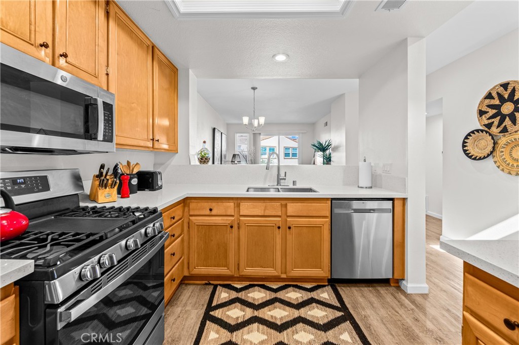 Kitchen view from the indoor laundry area. - 68 Verdin Lane, Aliso Viejo CA 92656 - photo 5