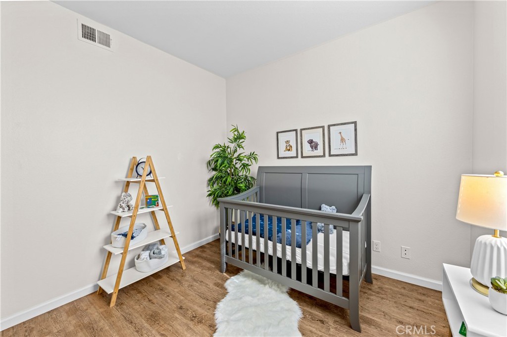 Bedroom one featuring abundant sunlight and generous closet space. - 68 Verdin Lane, Aliso Viejo CA 92656 - photo 7
