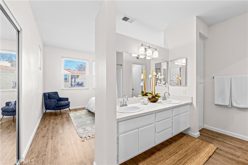 Primary full bath, double sinks, large linen closet, and separate WC. - 68 Verdin Lane, Aliso Viejo CA 92656 - photo 9
