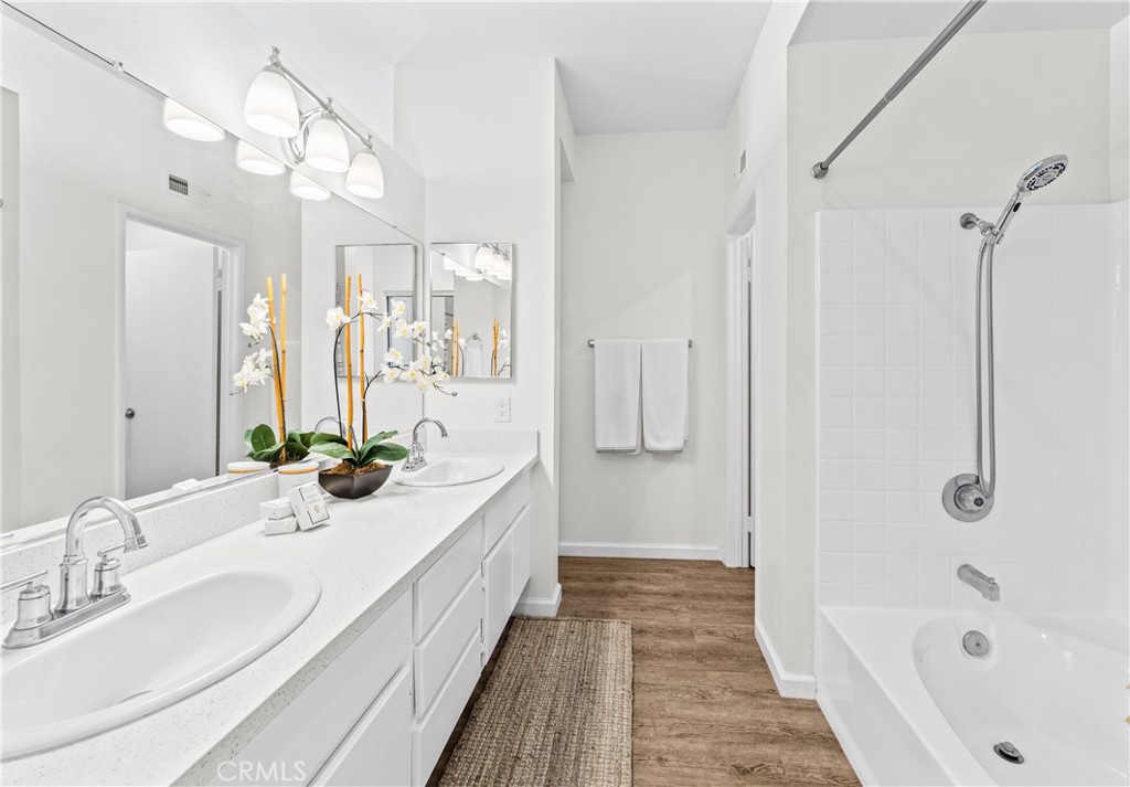 Looking at primary bath from entrance, reglazed tub and shower and private WC end on right. - 68 Verdin Lane, Aliso Viejo CA 92656 - photo 10