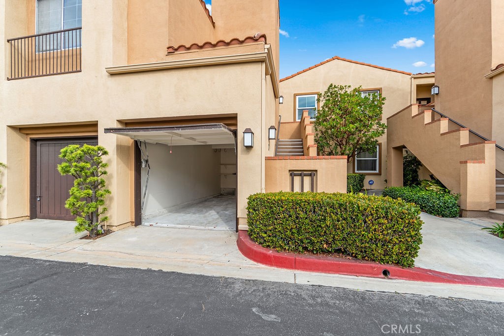 View into garage, room for one car and additional storage. - 68 Verdin Lane, Aliso Viejo CA 92656 - photo 17
