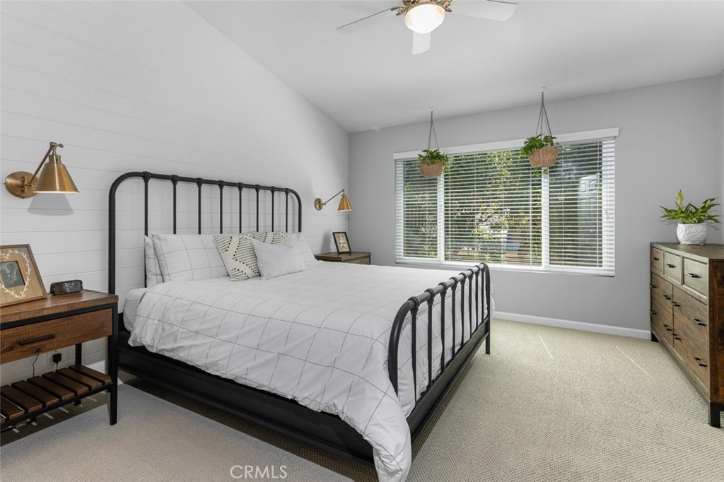 Primary Bedroom has designer finishes including Vaulted Ceilings, a Shiplap Accent Wall and two bedside Sconces - 9 Sequoia, Aliso Viejo CA 92656 - photo 18