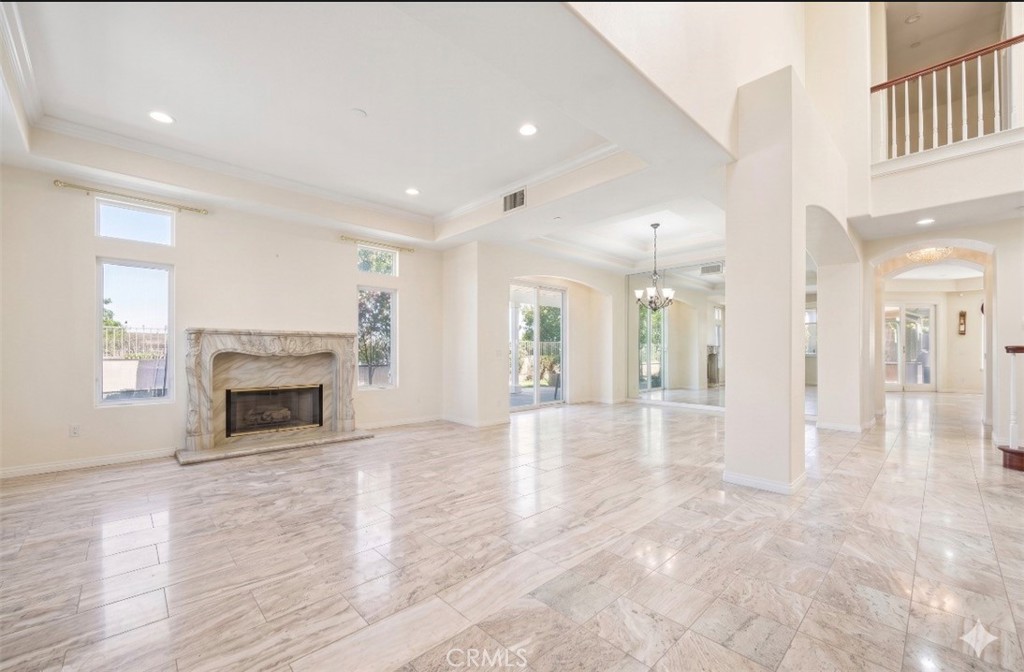 Formal living room w/ fireplace, dining room (Digitally altered) - 106 S Vista Grande, Anaheim Hills CA 92807 - photo 1