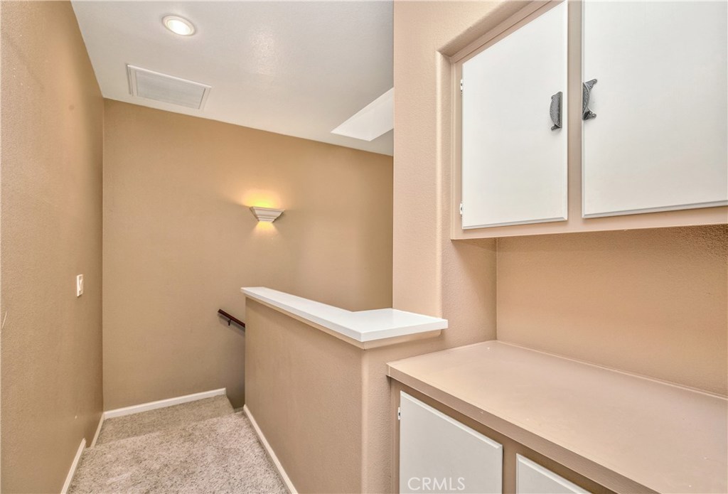 Upstairs hallway with linen cupboards - 1069 S Positano, Anaheim Hills CA 92808 - photo 17