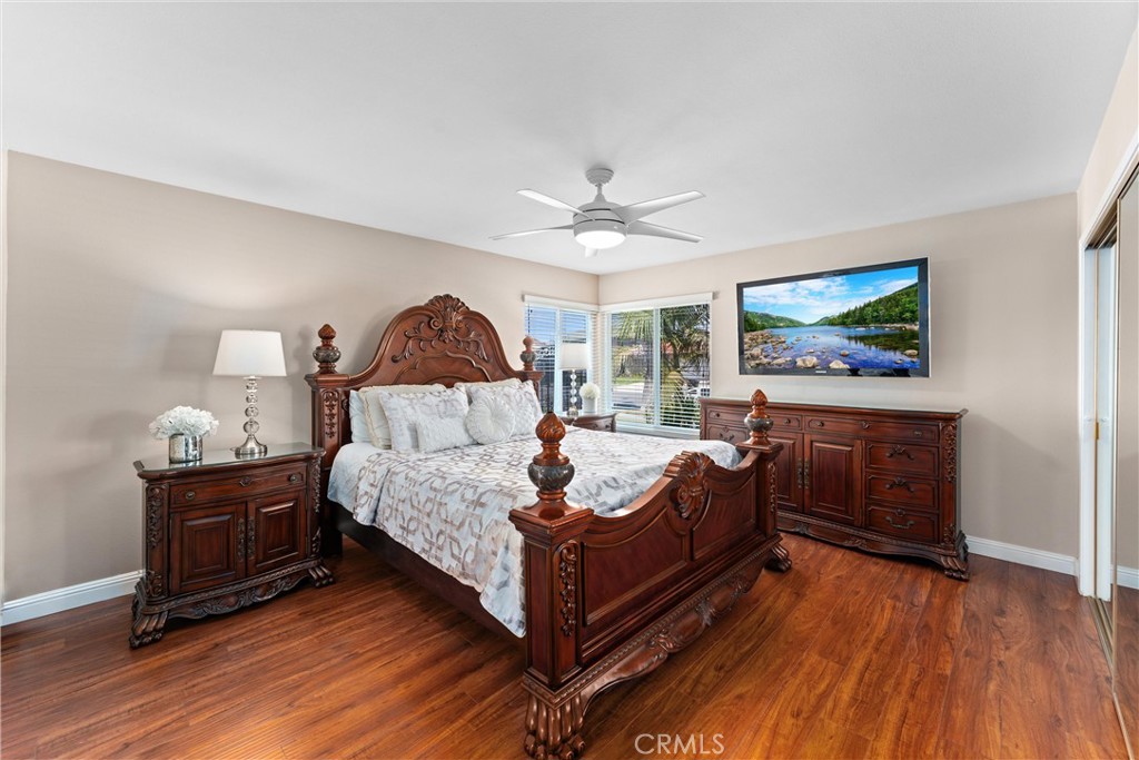 Large Downstairs Primary Bedroom - Beautiful Wood flooring updated windows throughout - 4360 E Addington Drive, Anaheim Hills CA 92807 - photo 1