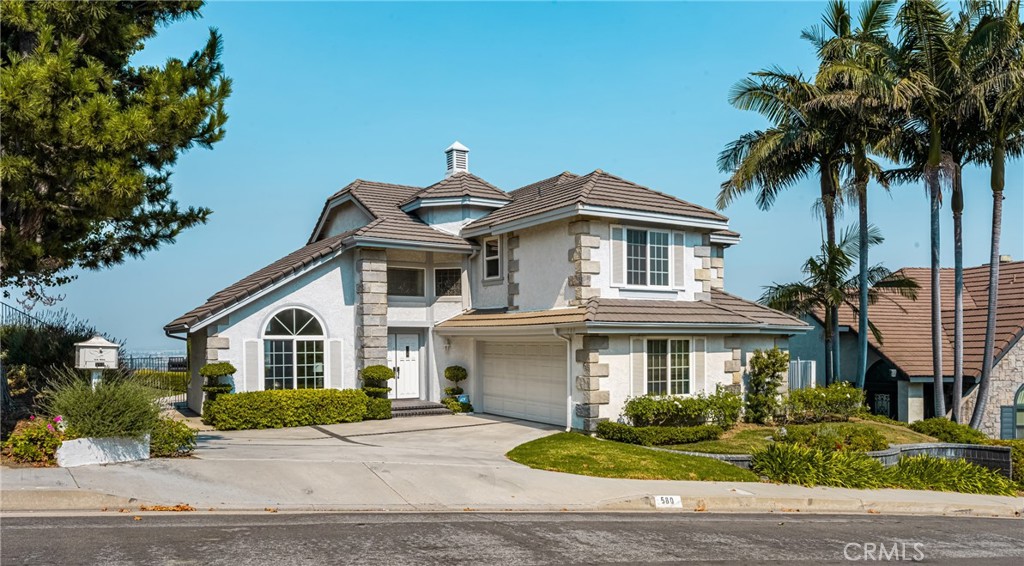 Elegant Two-Story Home with Lush Landscaping and Grand Entryway" - 580 S Londerry Ln, Anaheim Hills CA 92807 - photo 1