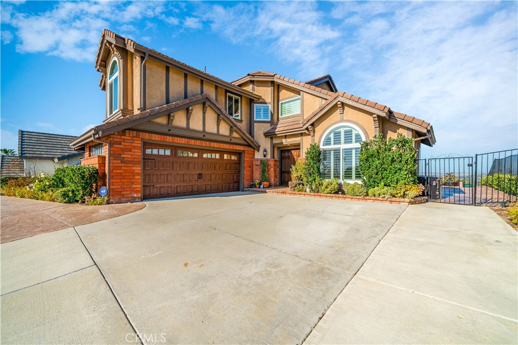 Secluded atop the hills of the Canyon Heights community in Anaheim Hills, this panoramic view home defines the word exce - 650 S Londerry Lane, Anaheim Hills CA 92807 - photo 1