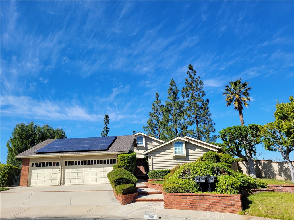 ! Your large four-bedroom single level home with a three-car garage is situated at the end of a cul de sac on a prime lo - 700 S Thrasher Way, Anaheim Hills CA 92807 - photo 1