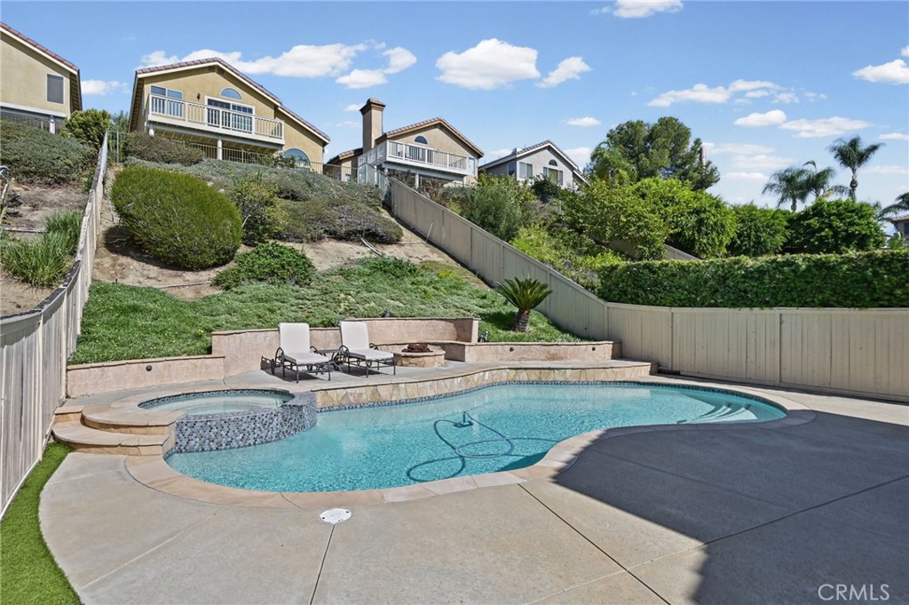 Private Pool was recently resurfaced and retiled. Notice the fire pit with seating around it. - 1028 S Brianna Way, Anaheim CA 92808 - photo 6