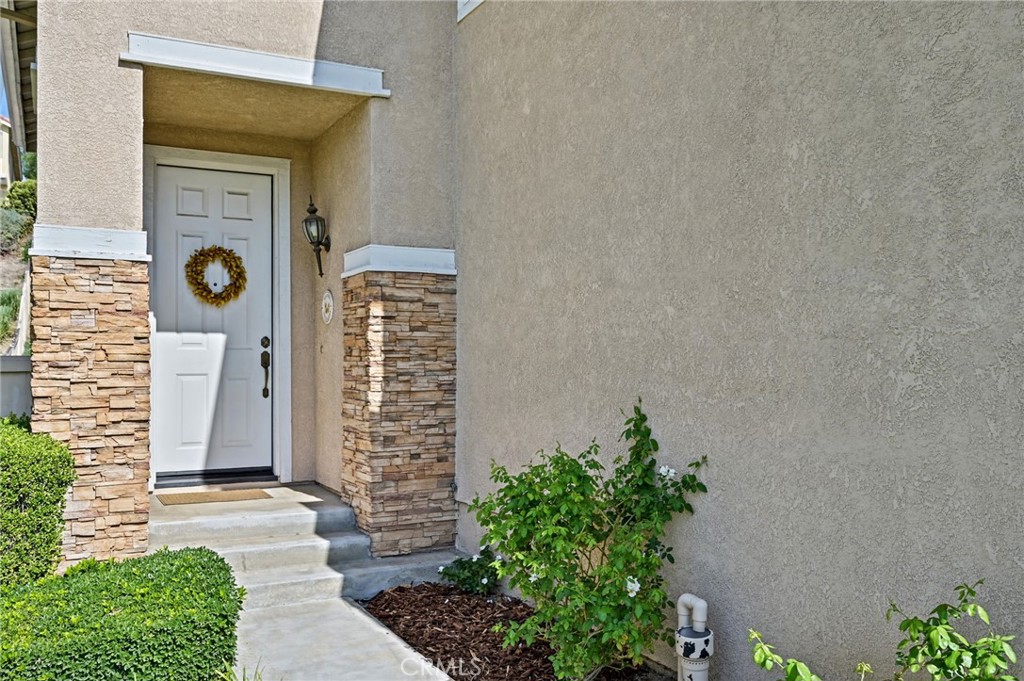 Entrance with stacked stone accents - 1028 S Brianna Way, Anaheim CA 92808 - photo 7