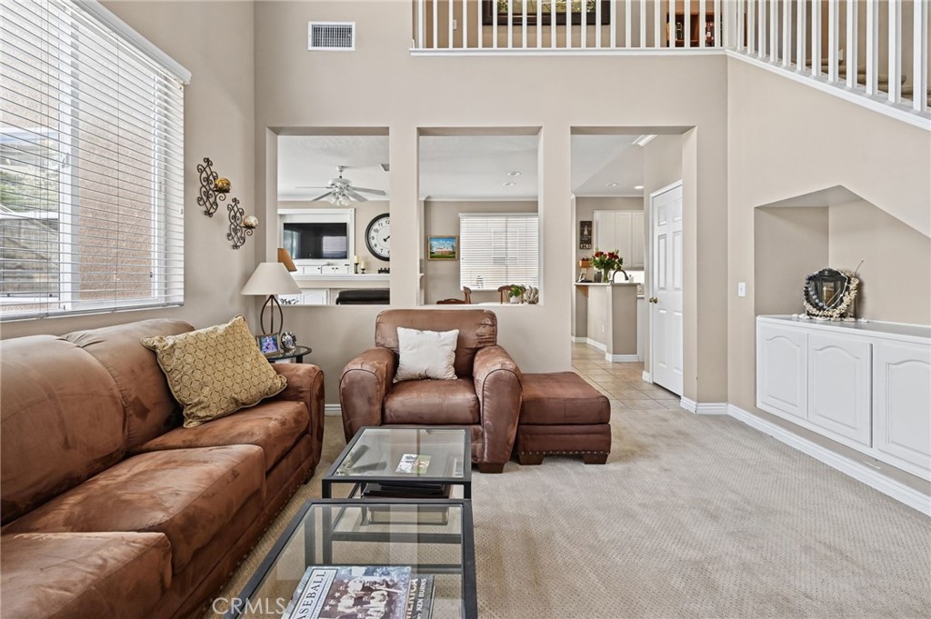 The Living Room has a built in cabinet and looks into the Family Room - 1028 S Brianna Way, Anaheim CA 92808 - photo 10