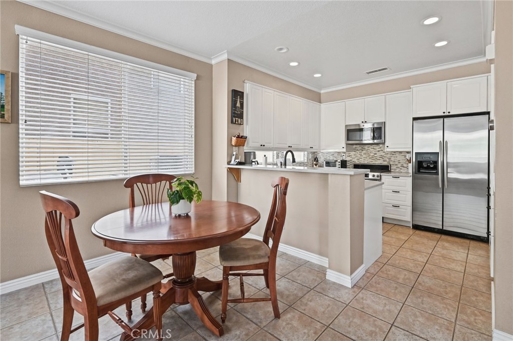 View of the remodeled kitchen and the dining area. - 1028 S Brianna Way, Anaheim CA 92808 - photo 20