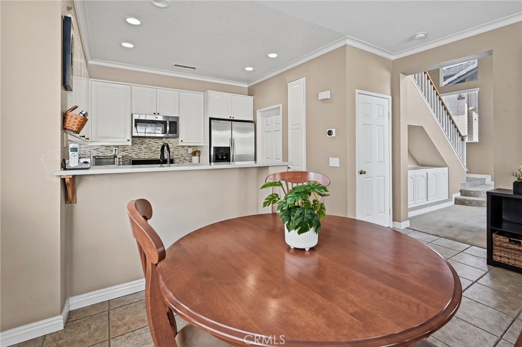 The dining area sits between the kitchen and the family room - 1028 S Brianna Way, Anaheim CA 92808 - photo 21