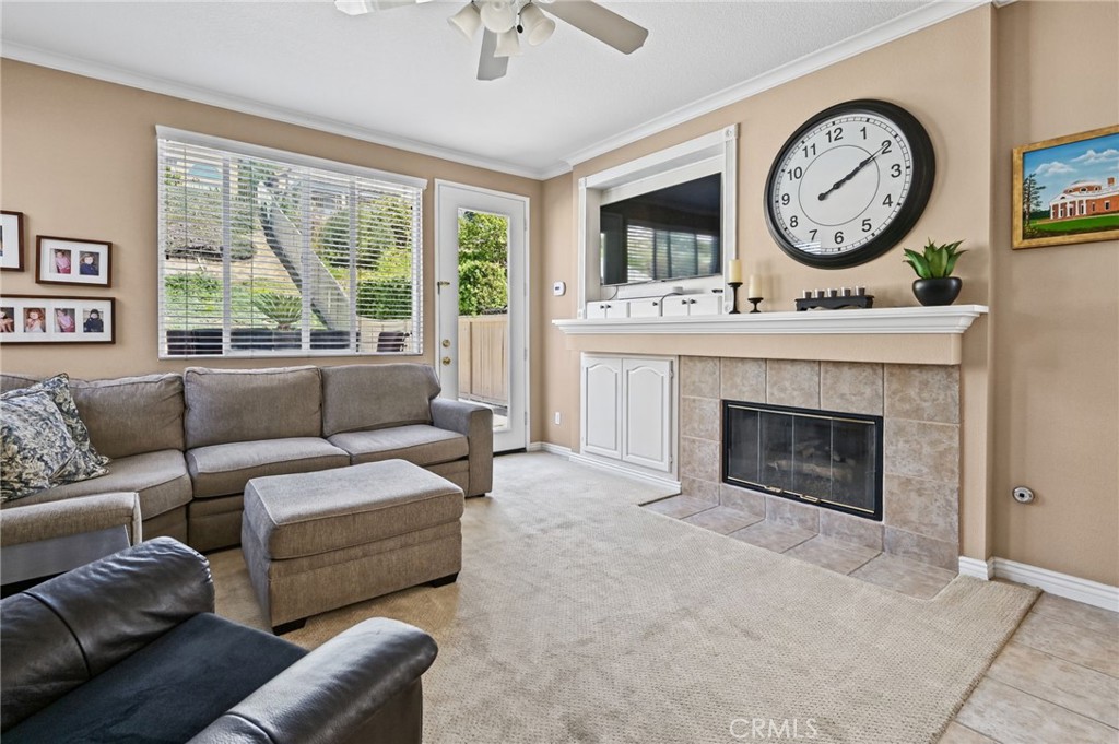 Family Room has a cozy fireplace - 1028 S Brianna Way, Anaheim CA 92808 - photo 23