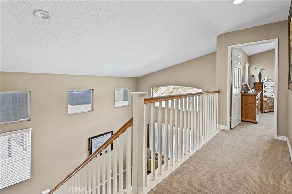 Upstairs Hallway leading to the Primary Bed & Bathroom - 1028 S Brianna Way, Anaheim CA 92808 - photo 29