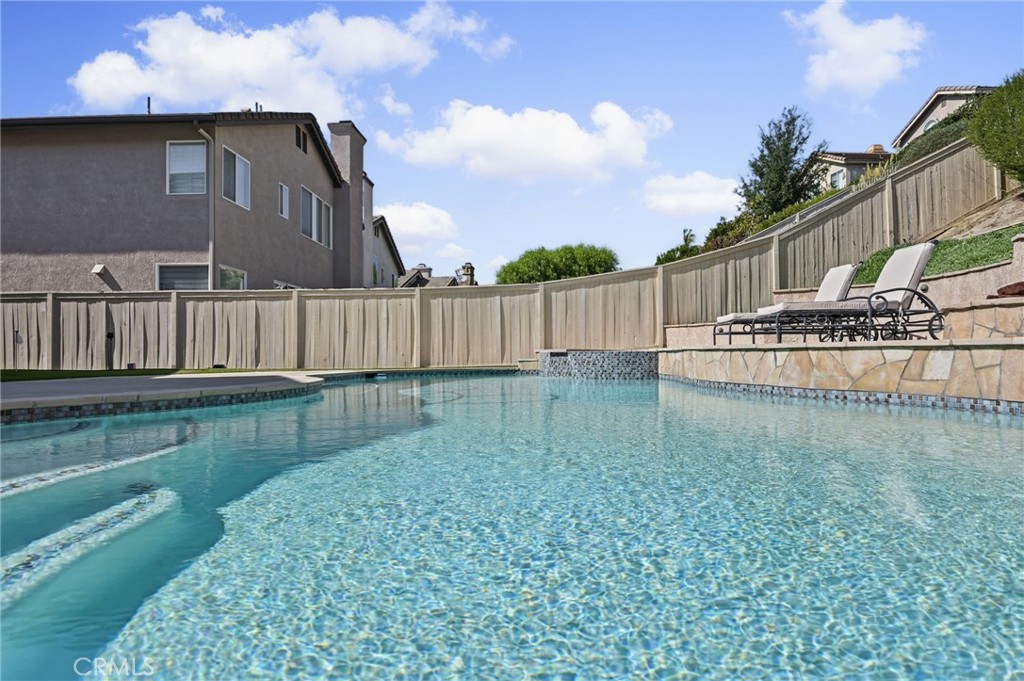 Side view of the Pool and Spa. New tile and pool surface was completed in 2025. - 1028 S Brianna Way, Anaheim CA 92808 - photo 44