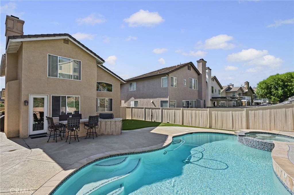 View of the Pool and Spa. The Built in BBQ makes this backyard perfect for entertaining! - 1028 S Brianna Way, Anaheim CA 92808 - photo 45