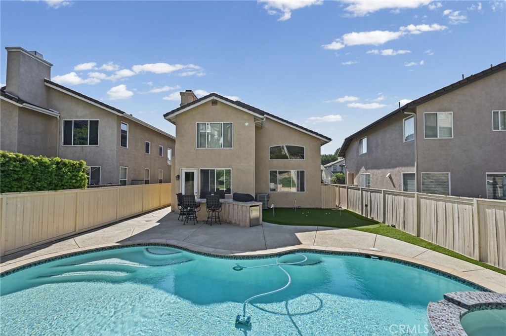 View of the House, Backyard BBQ, and Putting Green from the rear yard. - 1028 S Brianna Way, Anaheim CA 92808 - photo 46