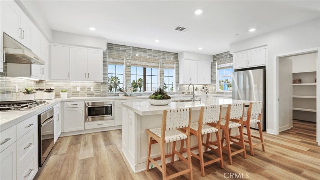 Photos shown are of model only- not actual homesite. - 1088 N Anaheim Boulevard 1, Anaheim CA 92801 - photo 1