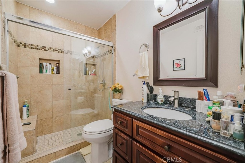 Remodeled primary bathroom with walk-in shower - 1174 N Dresden Street 37, Anaheim CA 92801 - photo 16