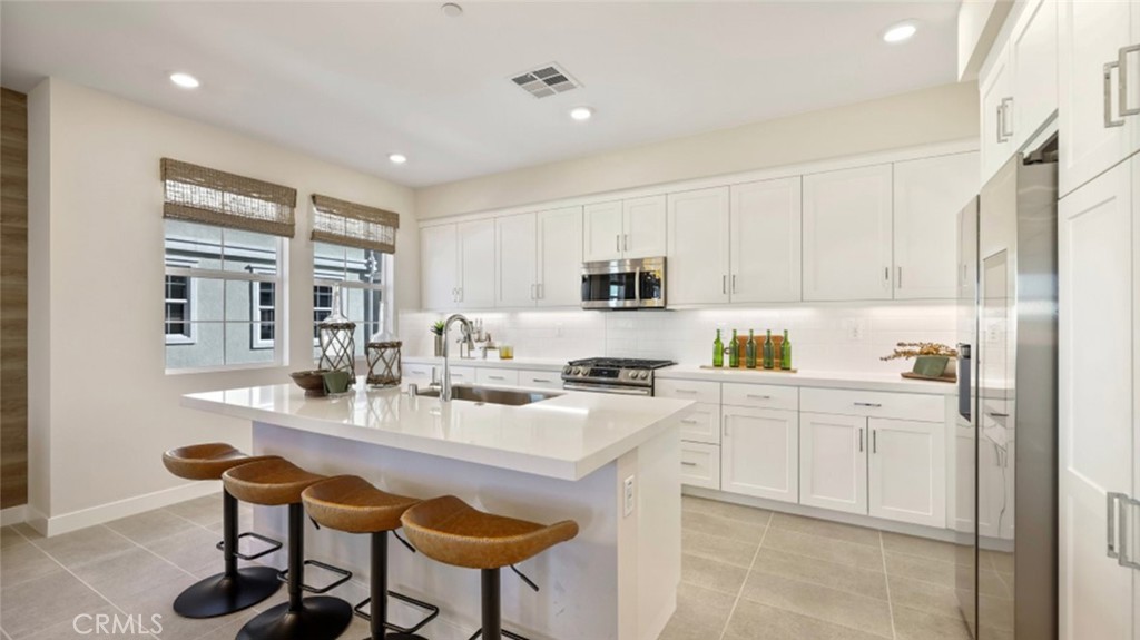Photos shown are of model only- not actual homesite. - 121 W La Palma Avenue 8, Anaheim CA 92801 - photo 1